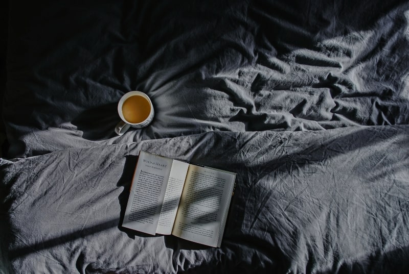 Morning Anxiety, unmade bed with tea and book