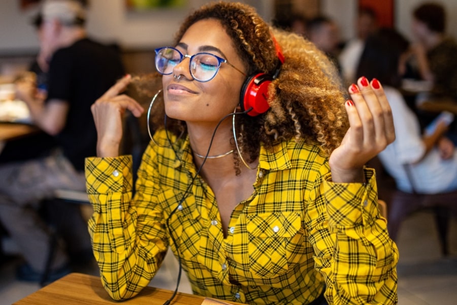 woman listening to personal growth podcasts