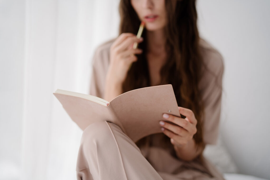 woman writing thoughts and feelings