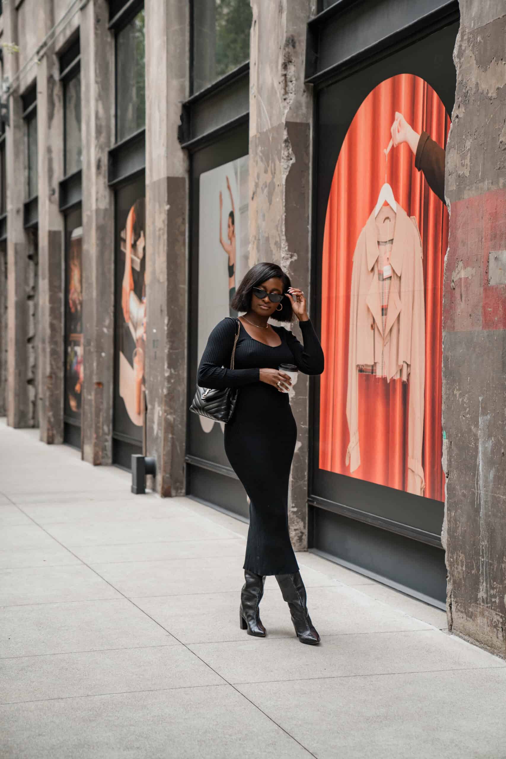 A confident young woman walking through the city, embodying the mindset shifts and ways to become that woman.