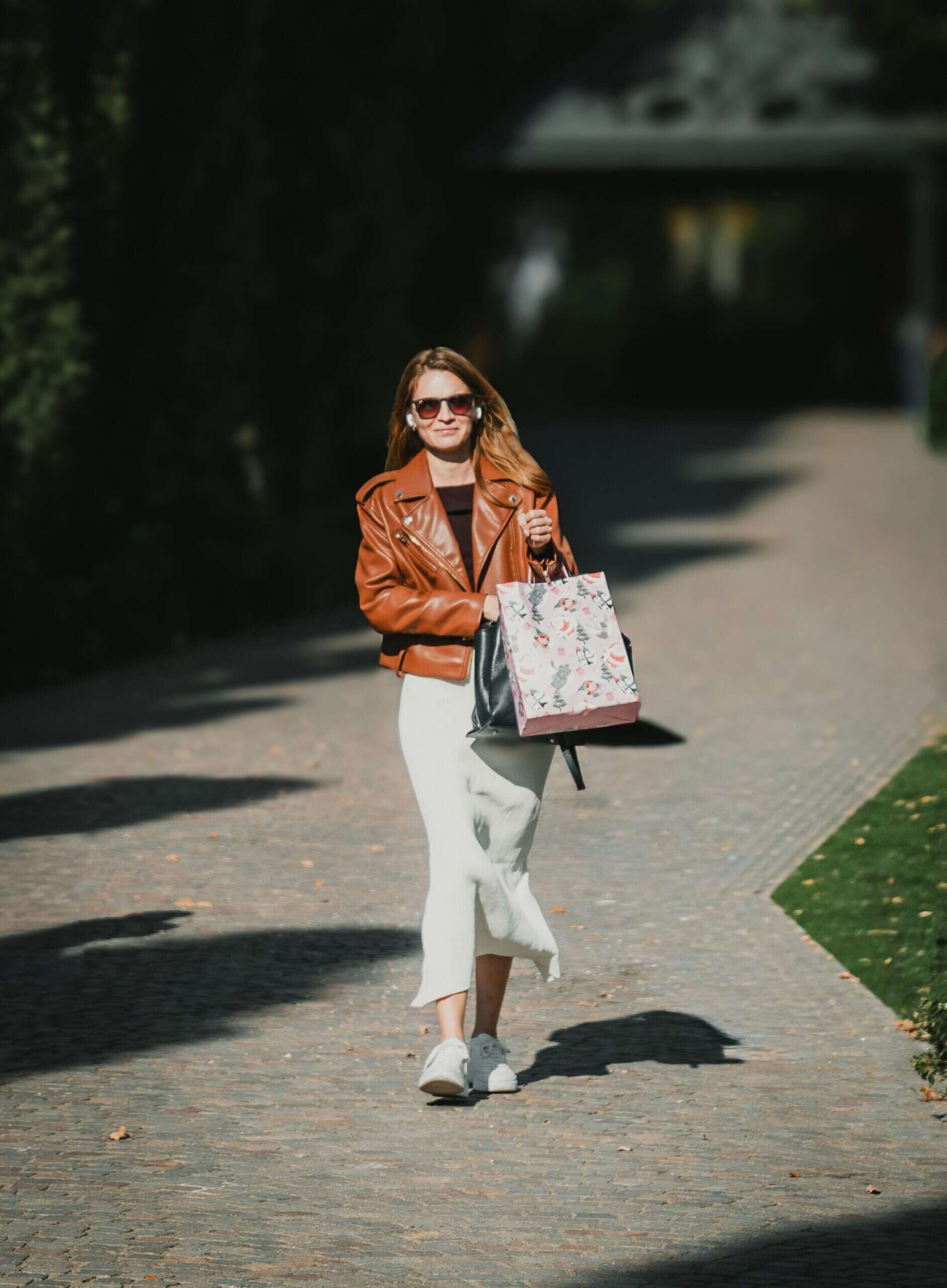 Woman walking outside with shopping bags, representing running errands with ADHD in a calmer, more manageable way.